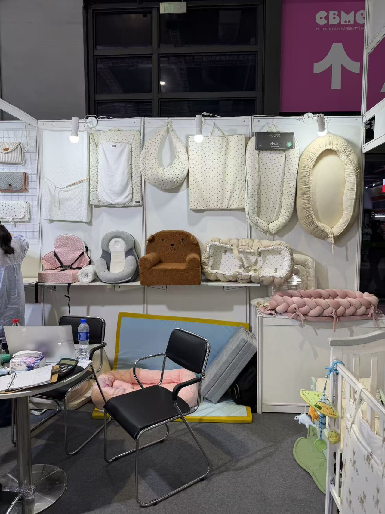 Baby nest and textile products displayed at a CBME China booth