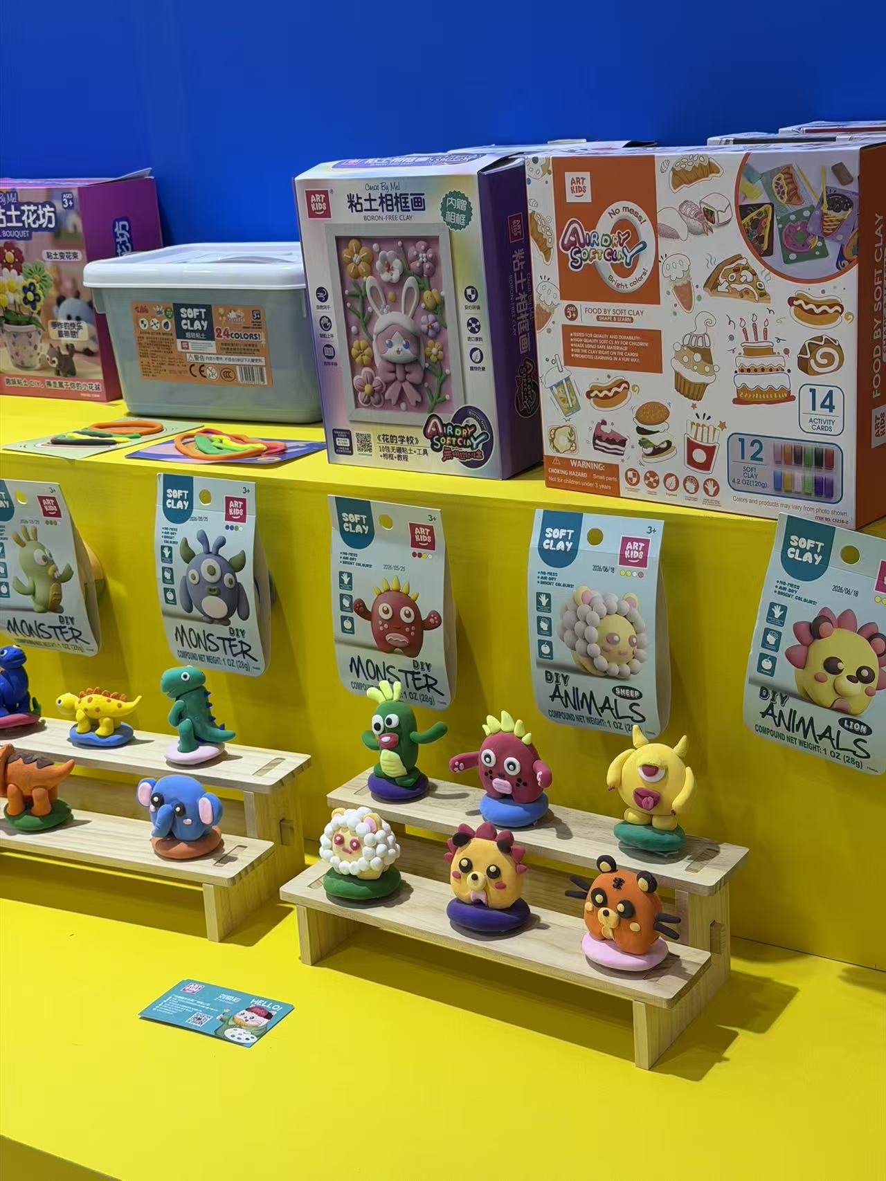 Soft clay and DIY craft kits displayed at a supplier booth