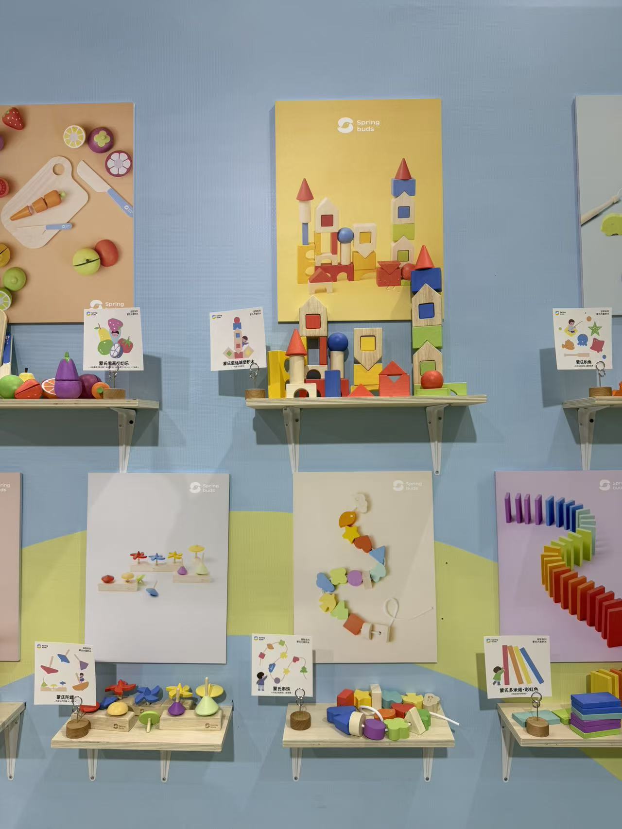 Colorful wooden building toys displayed at a supplier booth